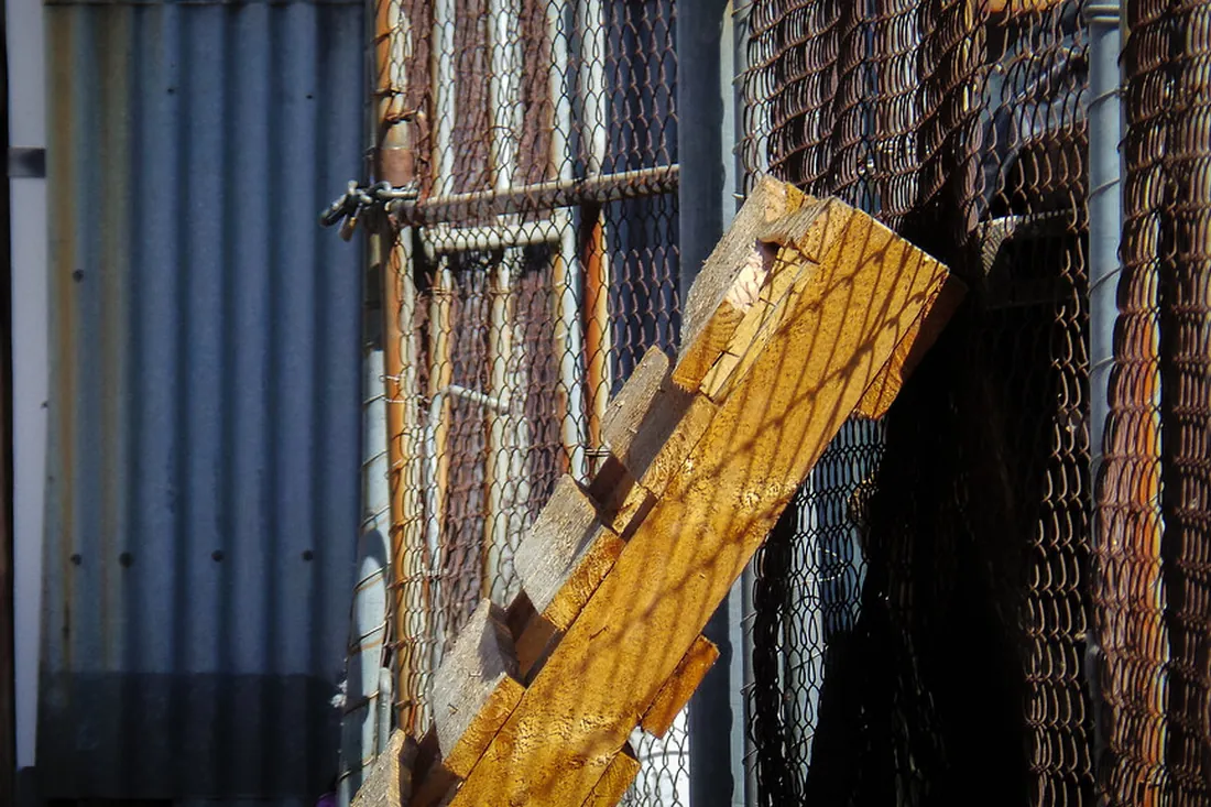 Close-up of a fence post repair and bracing