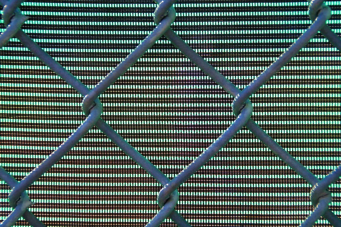 Commercial metal fence securing an Auckland property