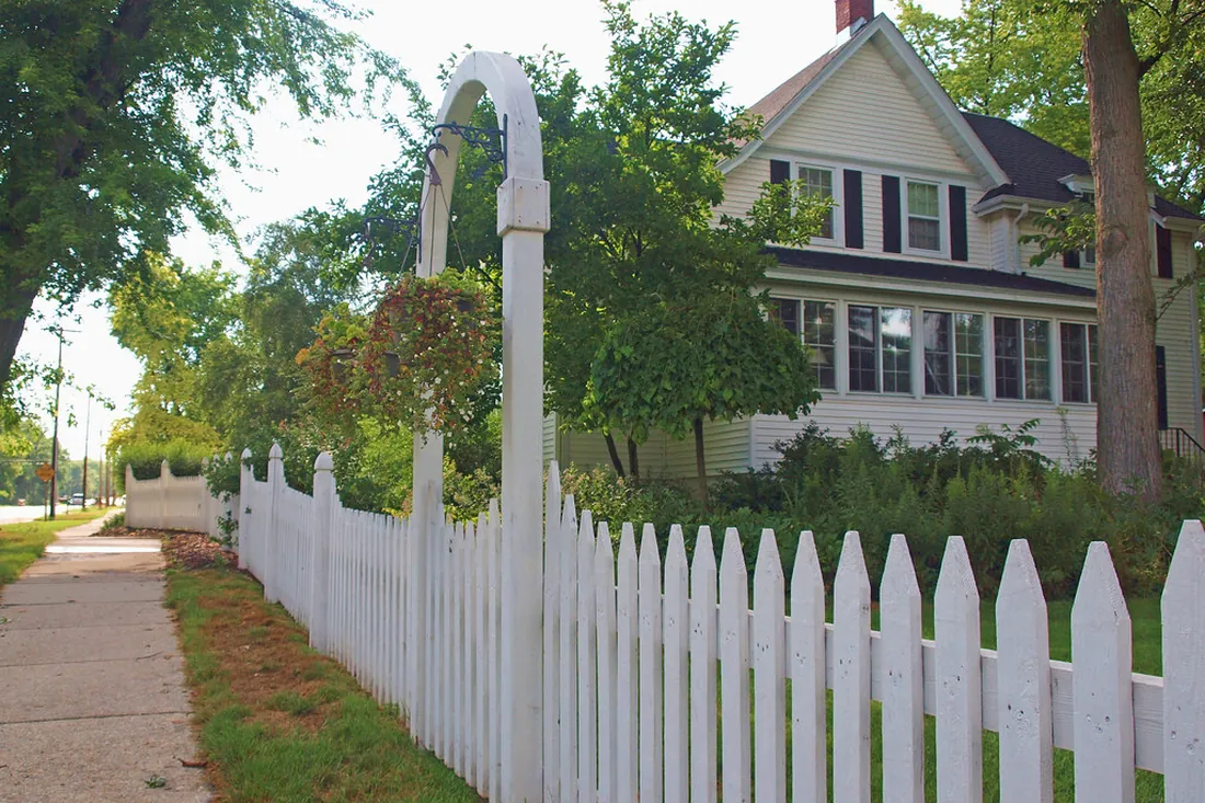 Close-up of a white PVC fence panel and rails