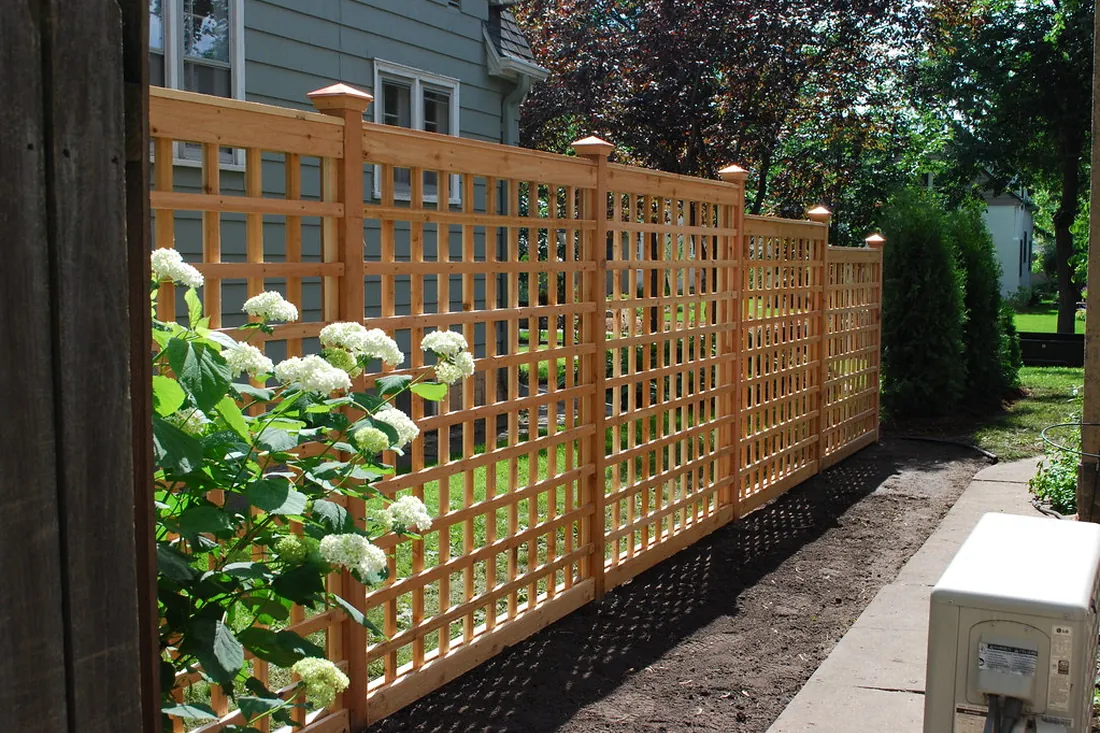 Decorative trellis fence adding garden privacy